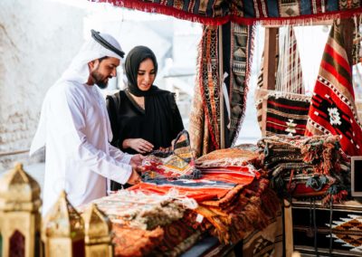 Happy Couple Spending Time In Dubai. Man And Woman Wearing Tradi