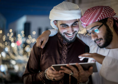Two Arab Men With Tablet In City At Night