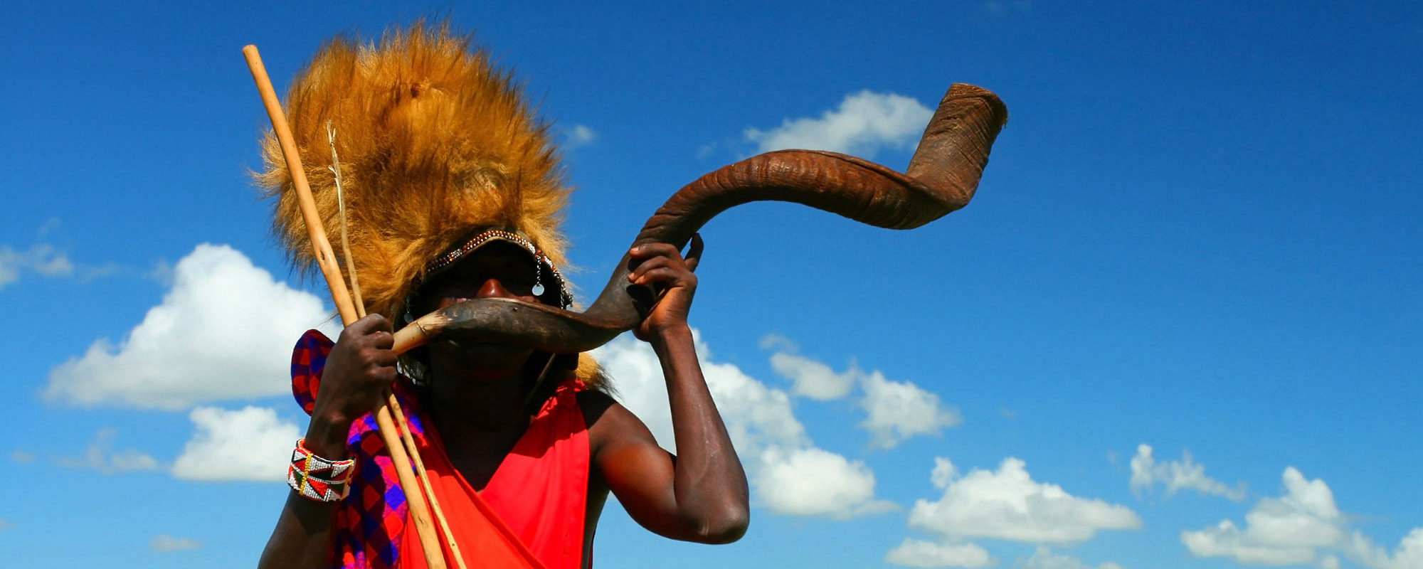 Masai Warrior Playing Traditional Horn