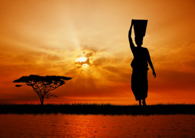 African Woman At Sunset