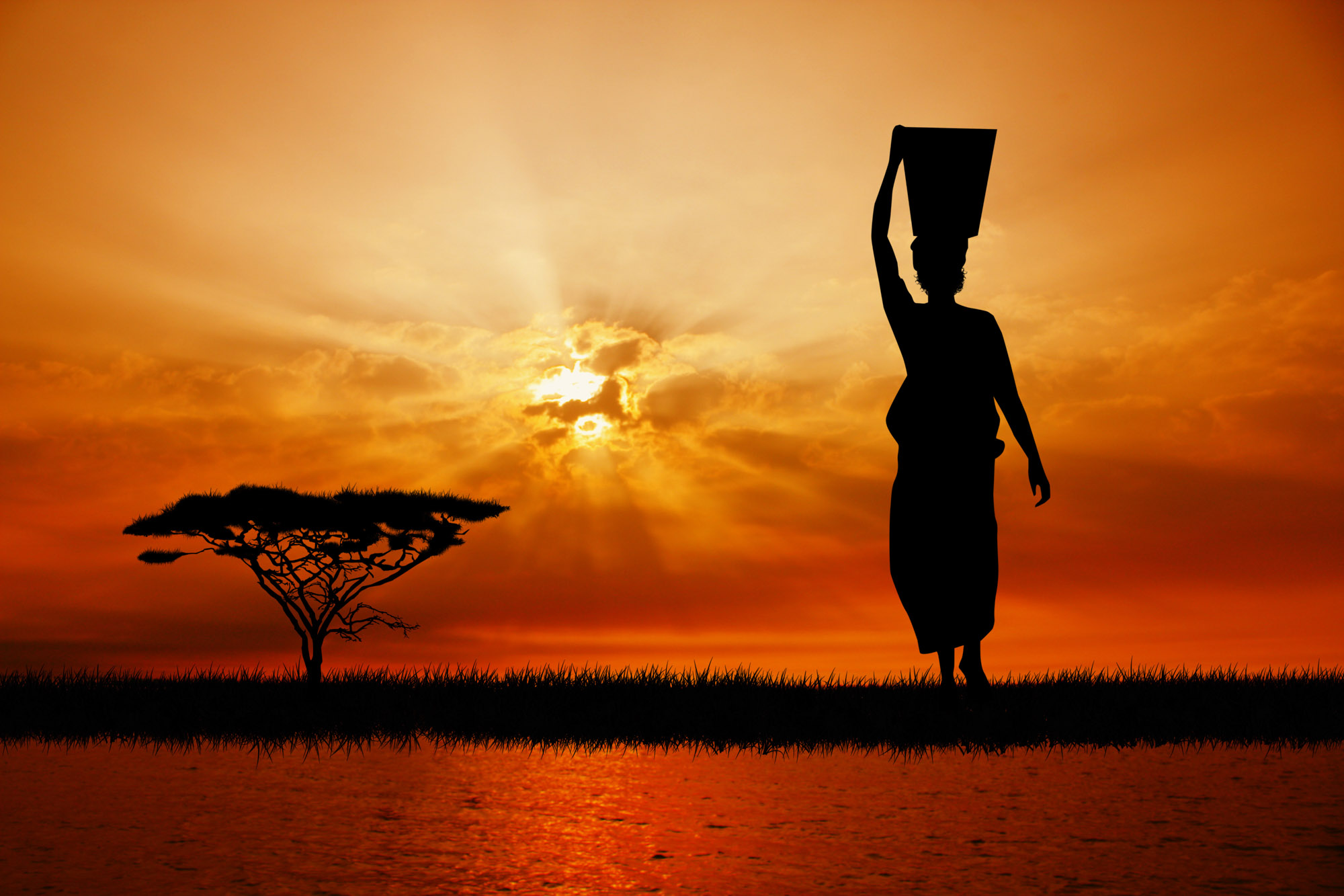 African Woman At Sunset