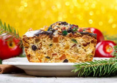Fruitcake With Dried Fruits And Nuts In Christmas Setting