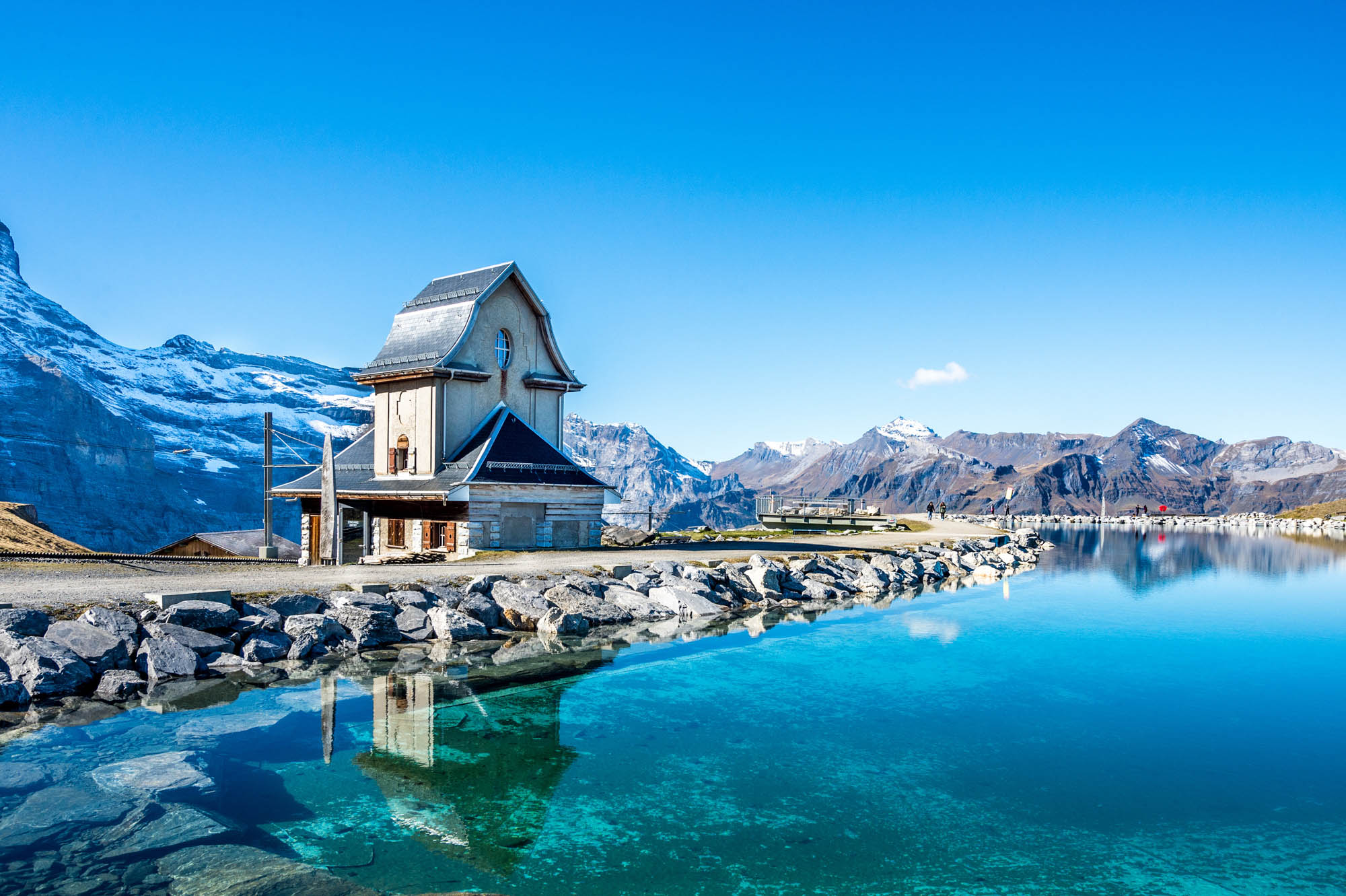 Water Reflection In Mountain Lake Above Grindelwald, Switzerland