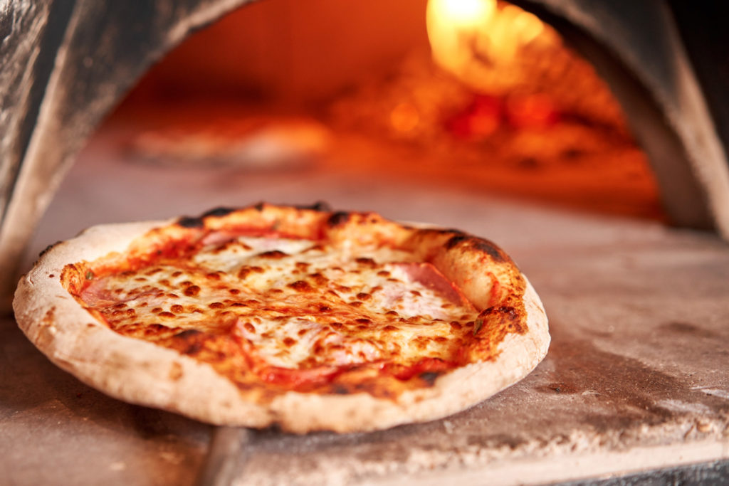 Baked Tasty Margherita Pizza In Traditional Wood Oven In Naples
