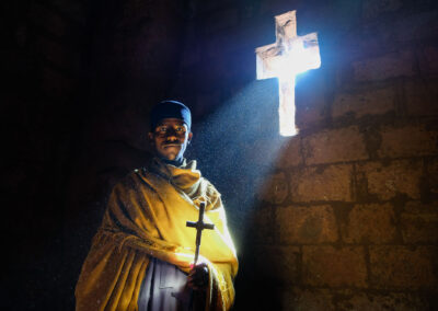Ethipia Travel Image. Young Priest Poses For A Portrait Inside O