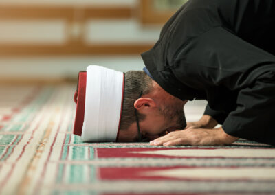Young Imam Praying Inside Of Beautiful Mosque