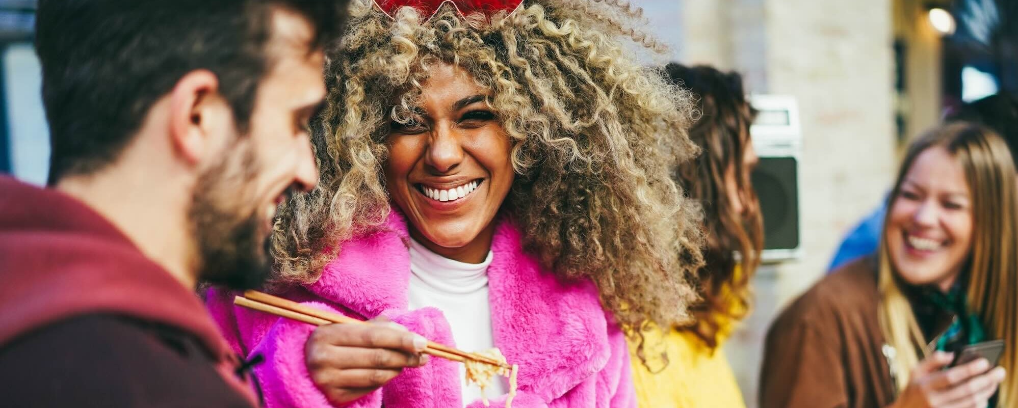 Happy Multiracial Friends Eating Takeaway Food Outdoor Focus On African Girl Face