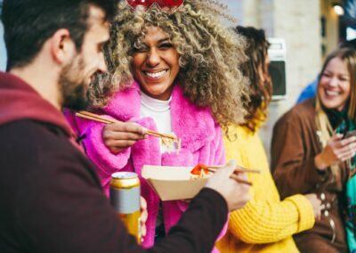 Happy Multiracial Friends Eating Takeaway Food Outdoor Focus On African Girl Face