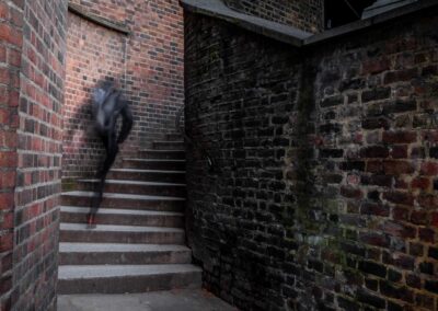 Man Rushing On An Alley In The Evening In London With Motion Blur Effect