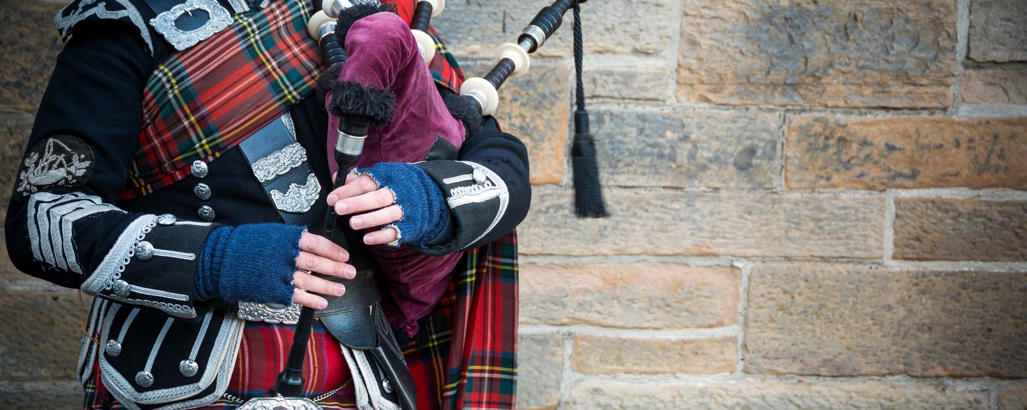 Playing The Bagpipes On Streets Of Edinburgh