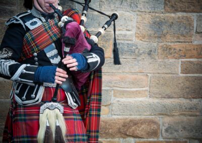 Playing The Bagpipes On Streets Of Edinburgh