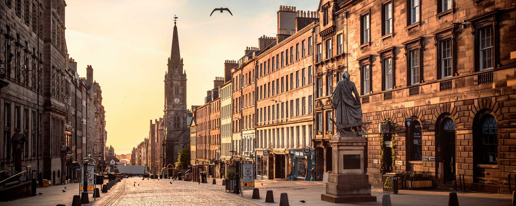 The View Of The Royal Mile And The Adam Smith Statue In The Sunrise Hours