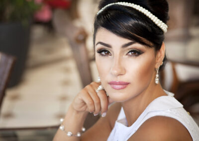 Woman In Cafe Restaurant With Retro Hairstyle And Makeup