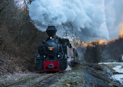 Steam Train Puffing Along The Tracks