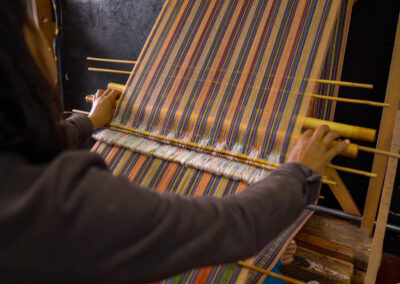 A Bhutanese Women Waeving Fabric In Thimphu, Bhutan