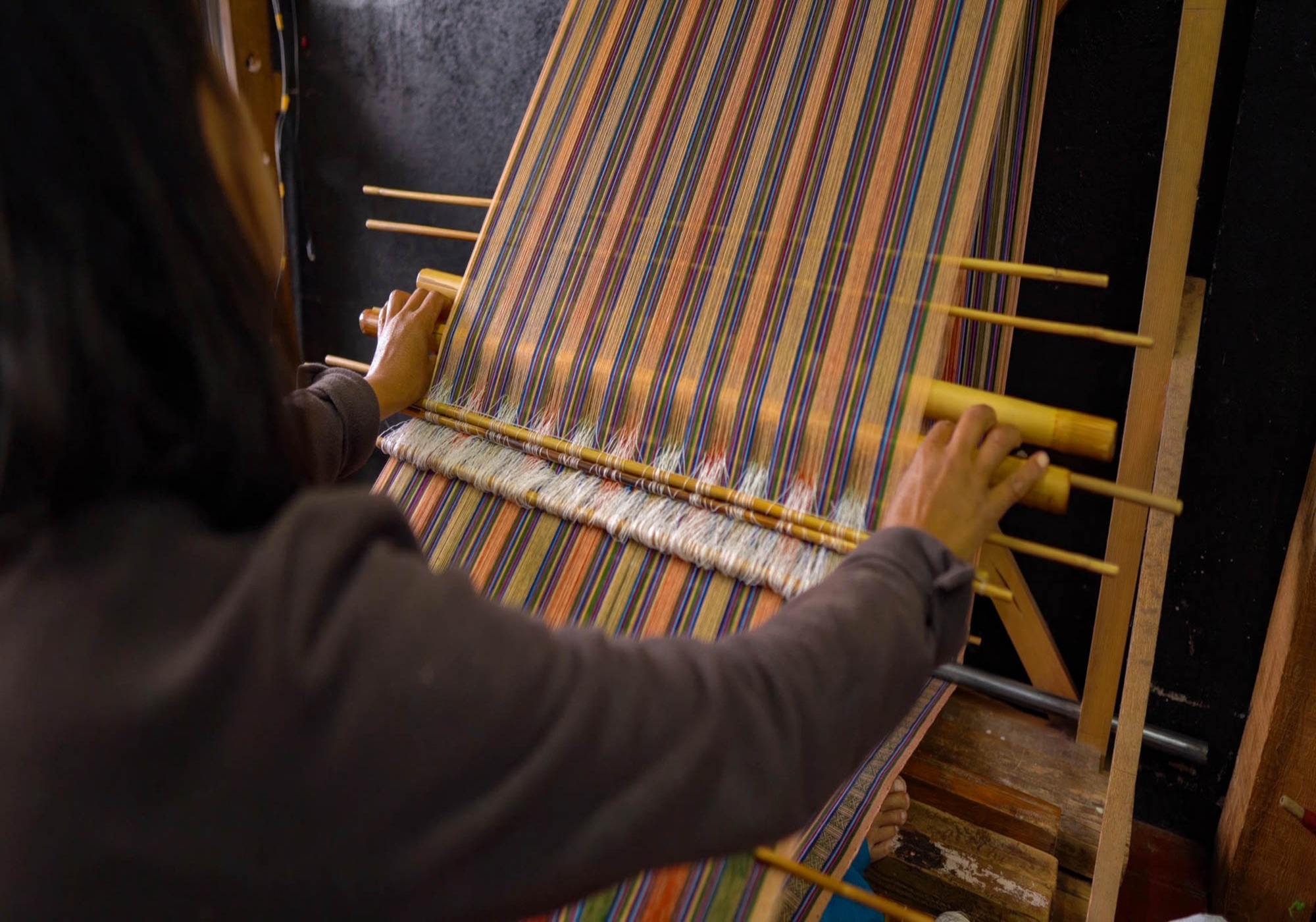 A Bhutanese Women Waeving Fabric In Thimphu, Bhutan