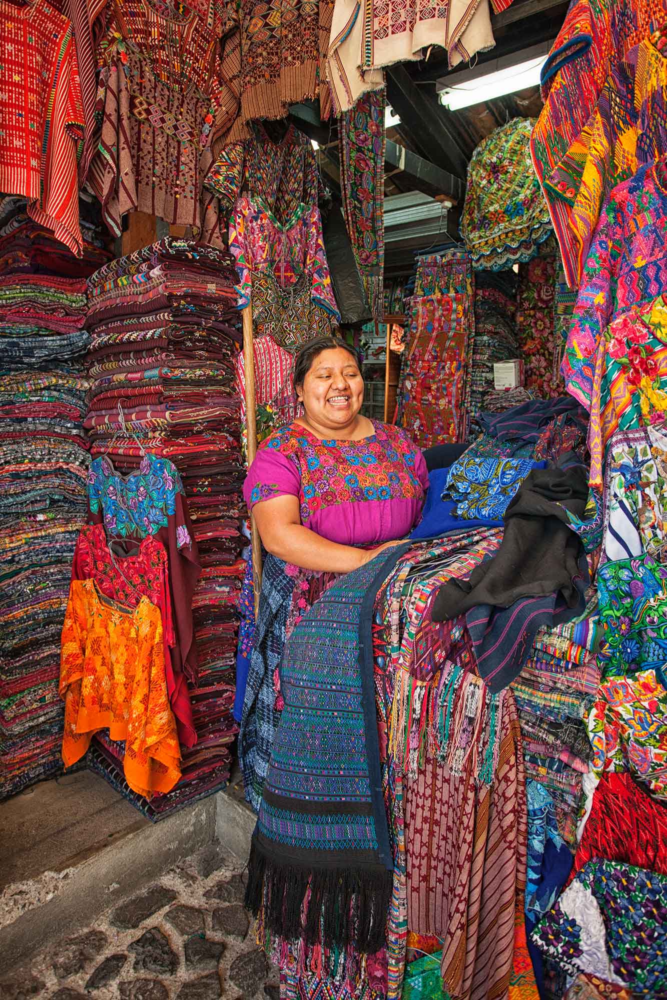 Woman In A Guatemala Shop Buying Traditional Clothes
