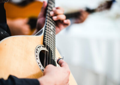 Close Up Of The Guitar Of A Man Playing Traditional Portuguese