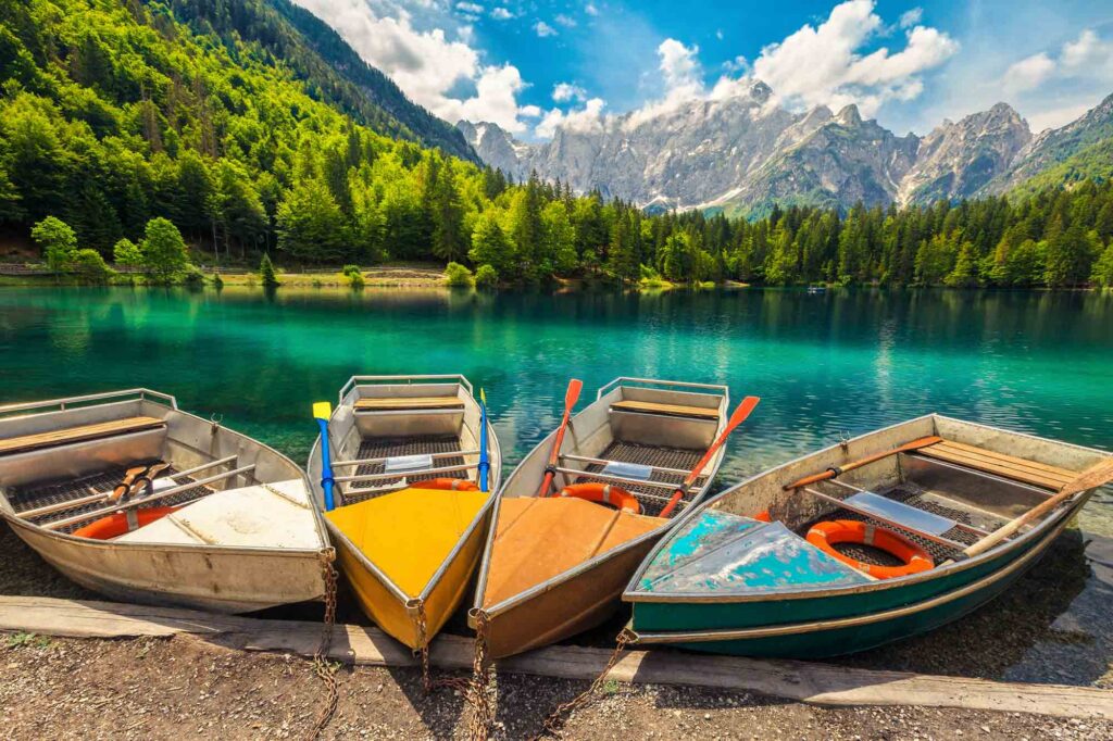 Admirable Alpine Landscape With Colorful Boats, Lake Fusine Admirable Alpine Landscape With Colorful Boats, Lake Fusine