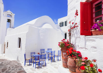 Traditional Greek Street With Flowers In Amorgos Island, Greece