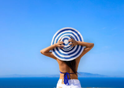 Happy A Holiday In Summer Blue Trend With Young Woman In Hat At