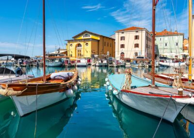 Small Pleasure And Fishing Boats In The Harbour Of The Holiday T