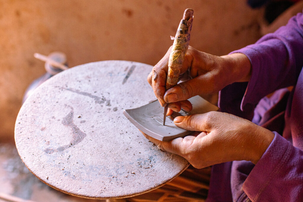 Engraving A Ceramic Piece By Hand in Safi Engraving A Ceramic Piece By Hand in Safi
